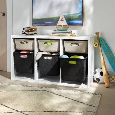 Brightroom bins - Highlights. 8 cube organizer provides plenty of space for bins, baskets and more. Can be set vertically or horizontally for versatile placement. Finished front and back in neutral hue. Each shelf holds up to 30lbs. Compatible with the Brightroom 13" Storage Bins. Includes hardware for self-assembly.